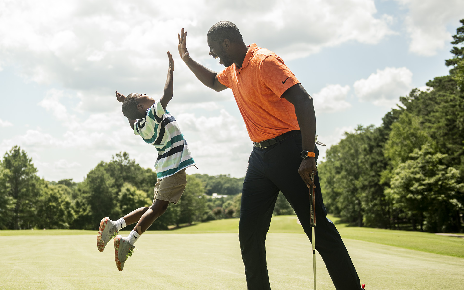 father and son golfing at Ardea